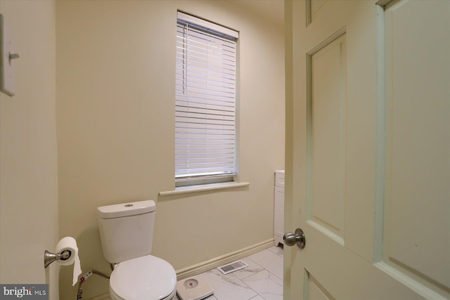 bathroom featuring toilet