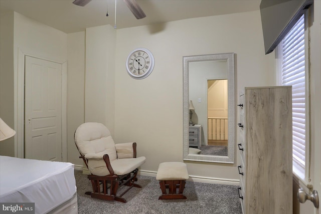 living area featuring ceiling fan