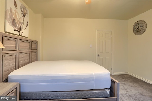 bedroom with light colored carpet