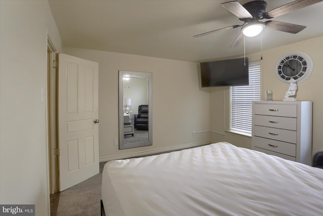 unfurnished bedroom with ceiling fan and light colored carpet