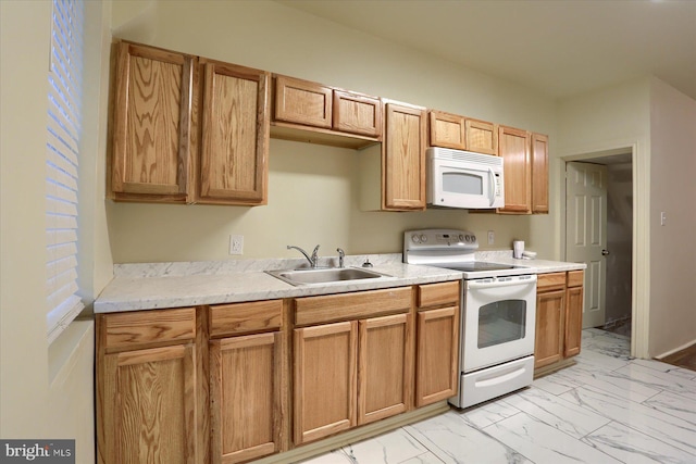 kitchen featuring sink and white appliances