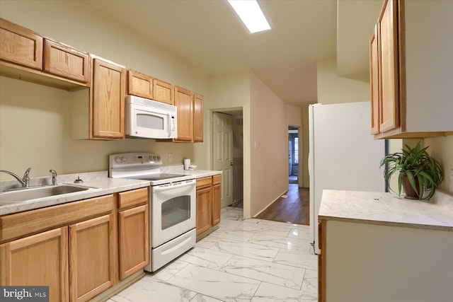 kitchen with sink and white appliances