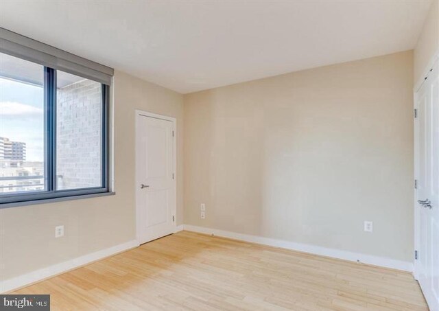 unfurnished room featuring light wood-type flooring