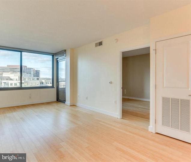 unfurnished room featuring light hardwood / wood-style floors