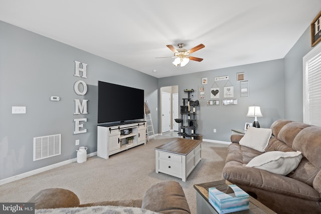 living room with light colored carpet and ceiling fan