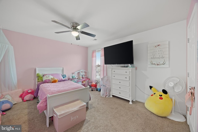 bedroom featuring light carpet and ceiling fan