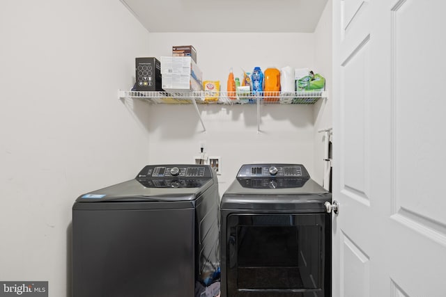 laundry area with independent washer and dryer