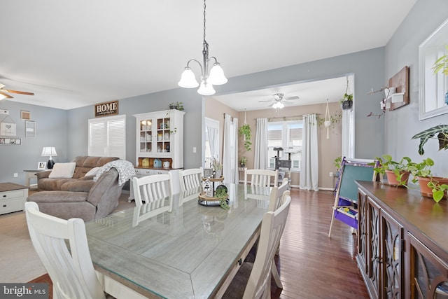 dining area with dark hardwood / wood-style floors and ceiling fan