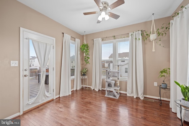 doorway to outside featuring hardwood / wood-style floors and ceiling fan