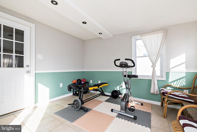 workout room featuring light tile patterned flooring