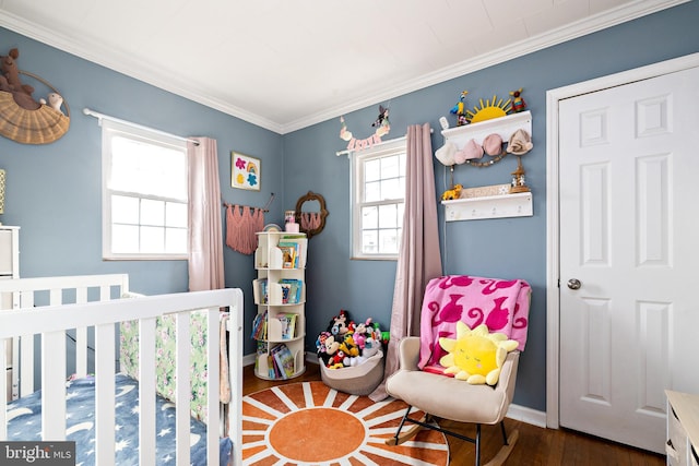 bedroom with crown molding and dark hardwood / wood-style floors