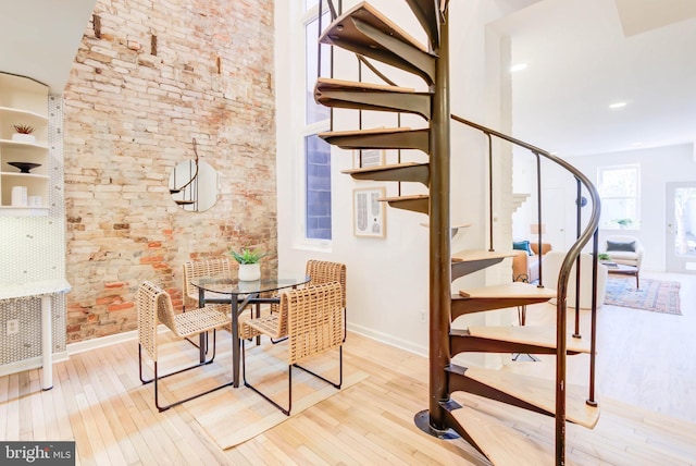 stairs featuring hardwood / wood-style flooring