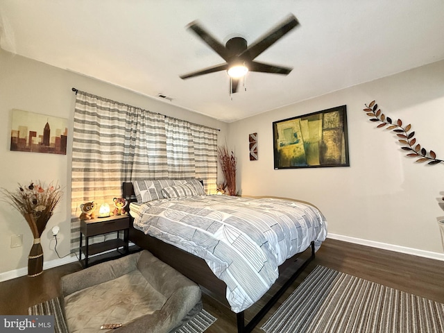 bedroom featuring ceiling fan and dark hardwood / wood-style floors