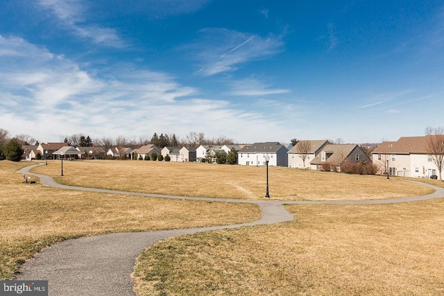 view of property's community featuring a yard