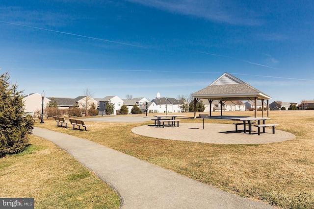 surrounding community featuring a gazebo and a lawn