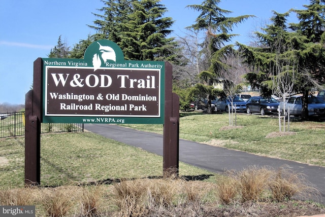 community / neighborhood sign with a lawn