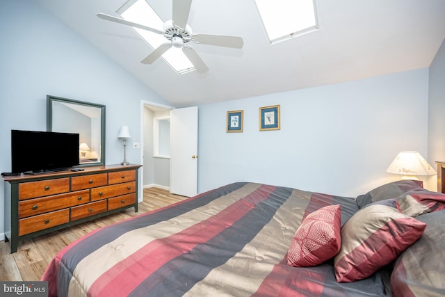 bedroom with vaulted ceiling, light hardwood / wood-style floors, and ceiling fan