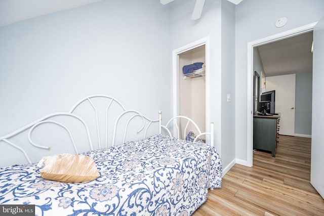 bedroom featuring light hardwood / wood-style floors and a closet