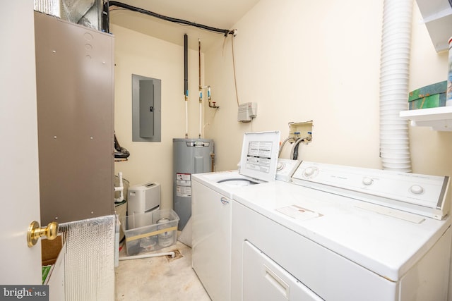 clothes washing area with water heater, electric panel, and independent washer and dryer