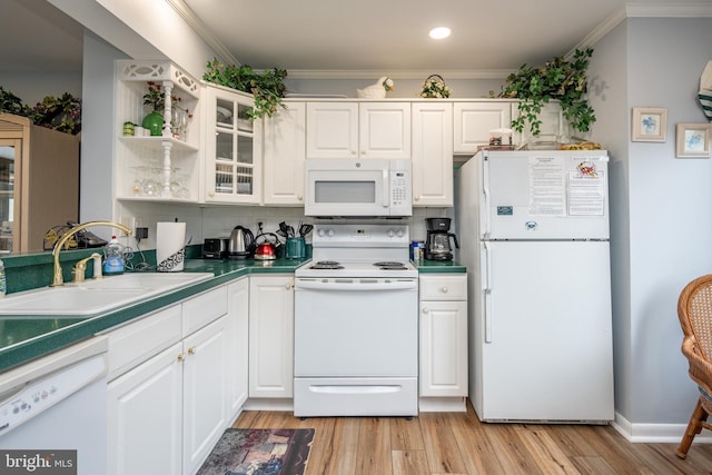 kitchen with sink, white appliances, light hardwood / wood-style flooring, crown molding, and white cabinetry