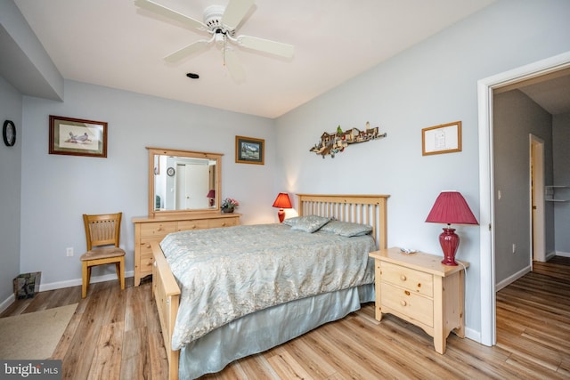 bedroom featuring ceiling fan and light hardwood / wood-style flooring