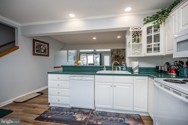 kitchen with ornamental molding, sink, white cabinets, and white appliances