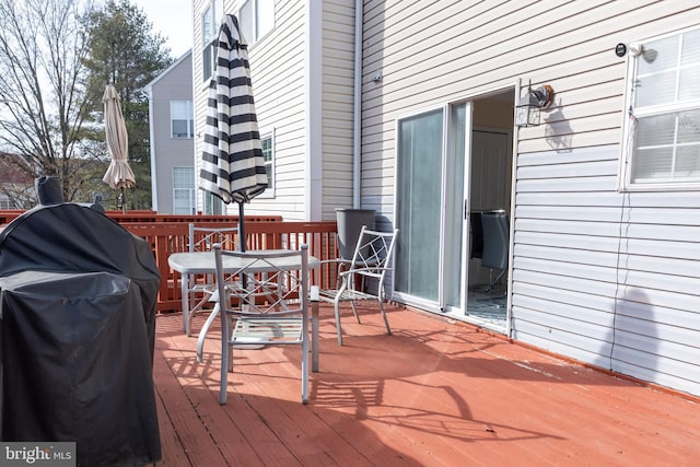 wooden deck featuring area for grilling