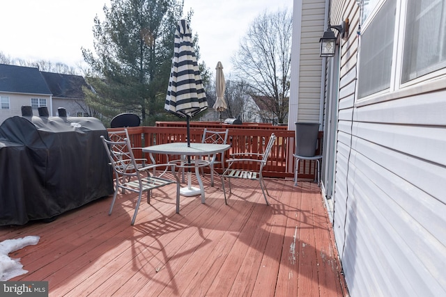 wooden terrace featuring area for grilling