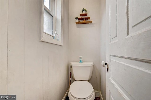 bathroom featuring toilet and a healthy amount of sunlight