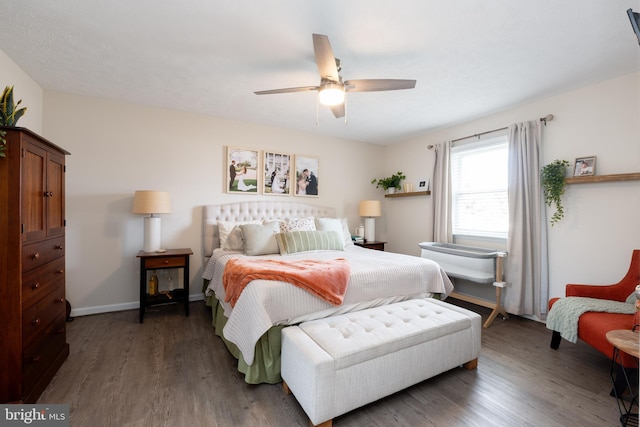 bedroom featuring dark wood-type flooring and ceiling fan