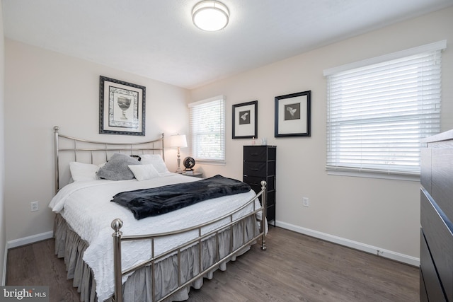 bedroom with wood-type flooring