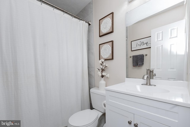 bathroom with vanity and toilet