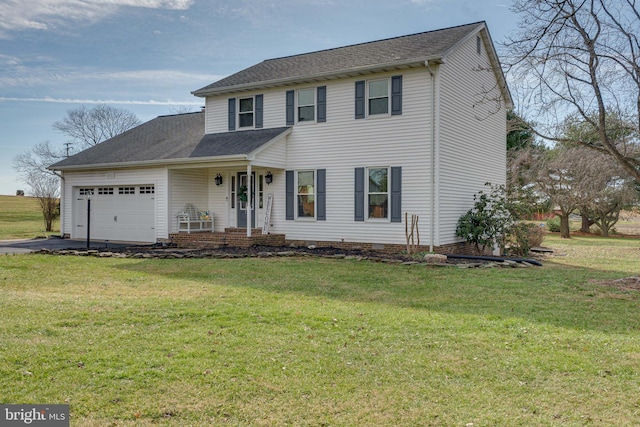 view of front of property with a garage, a front yard, and a porch