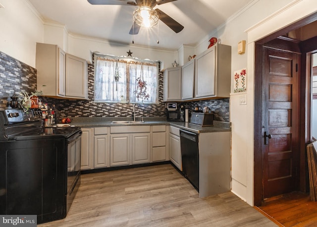 kitchen featuring sink, decorative backsplash, light hardwood / wood-style flooring, and black appliances