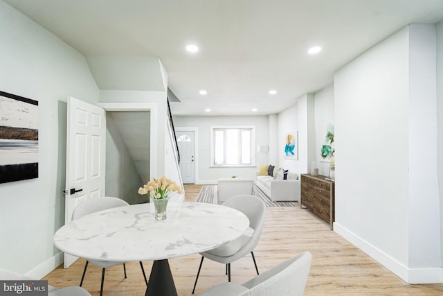 dining area with light hardwood / wood-style flooring