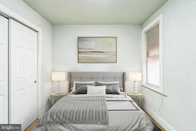 bedroom with wood-type flooring