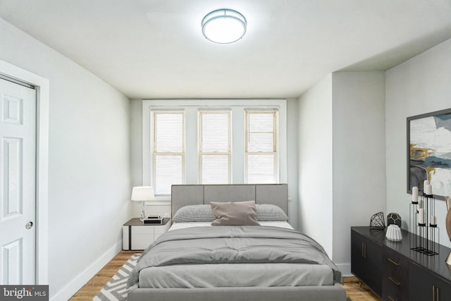 bedroom with light hardwood / wood-style flooring