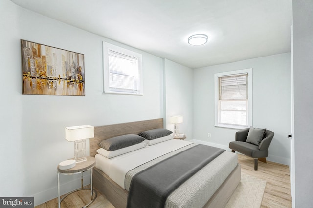 bedroom with light hardwood / wood-style floors