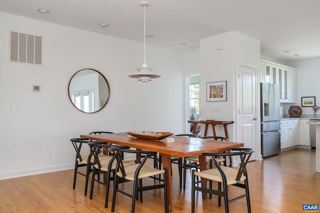 dining room featuring light hardwood / wood-style flooring