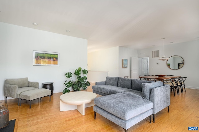 living room with light hardwood / wood-style floors