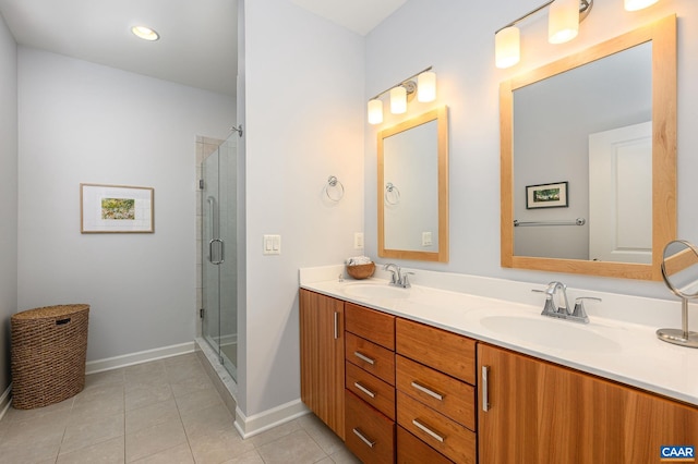 bathroom with walk in shower, tile patterned floors, and vanity