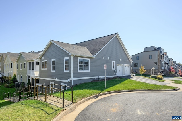 view of side of property with cooling unit, a garage, and a lawn