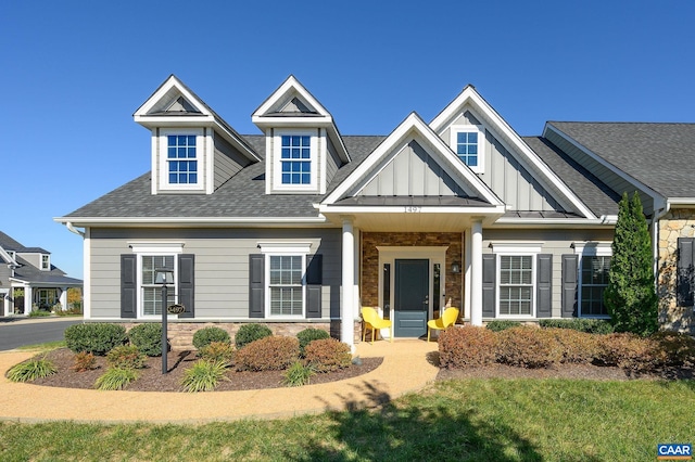 craftsman inspired home with a front lawn