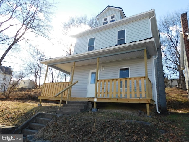 rear view of house with a porch