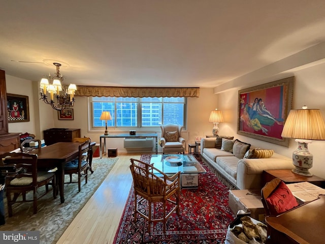 living room featuring hardwood / wood-style floors and a chandelier