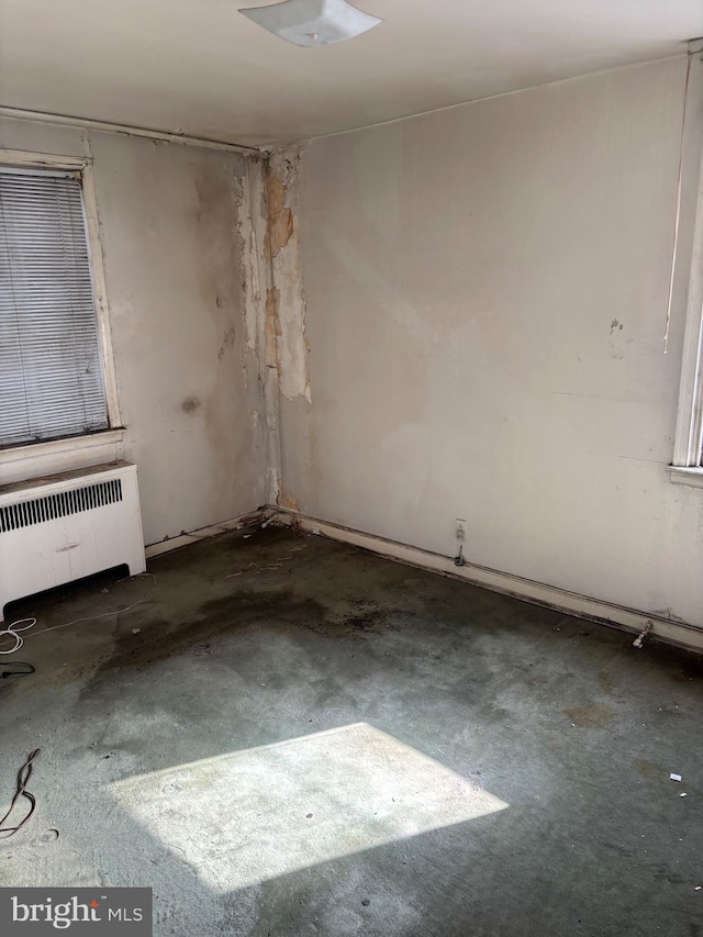 unfurnished room with radiator