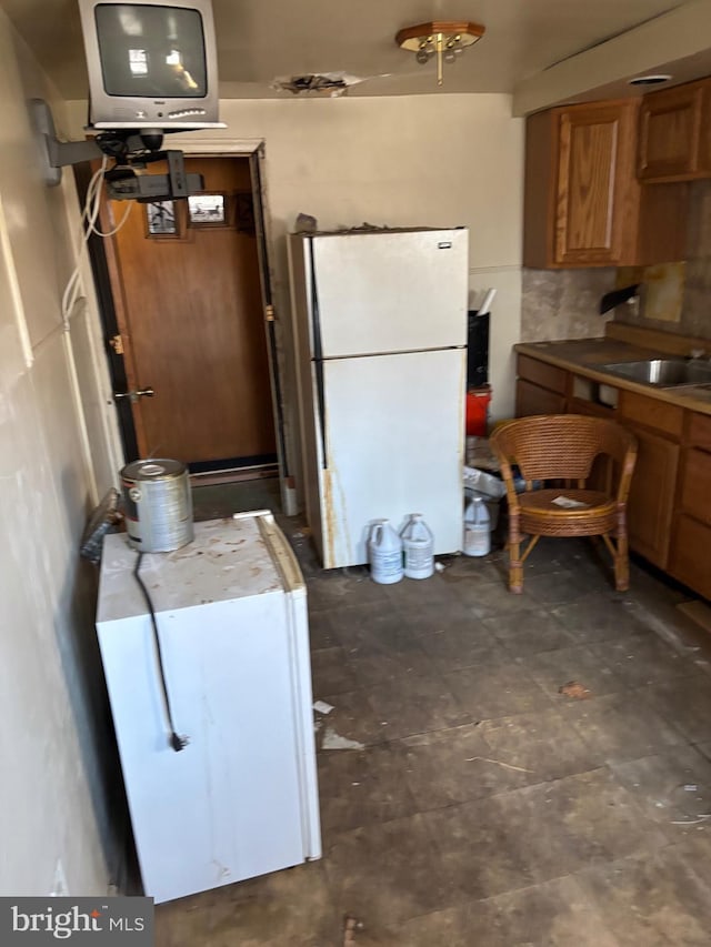 kitchen with white fridge and sink