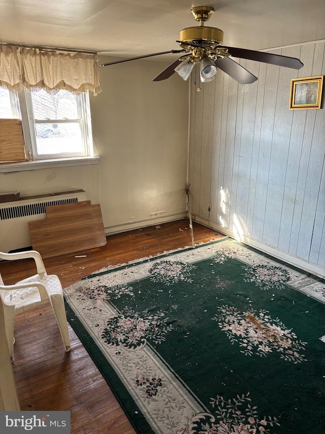 interior space featuring hardwood / wood-style flooring and radiator heating unit