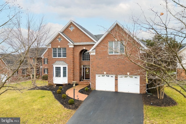 view of front property with a garage and a front lawn