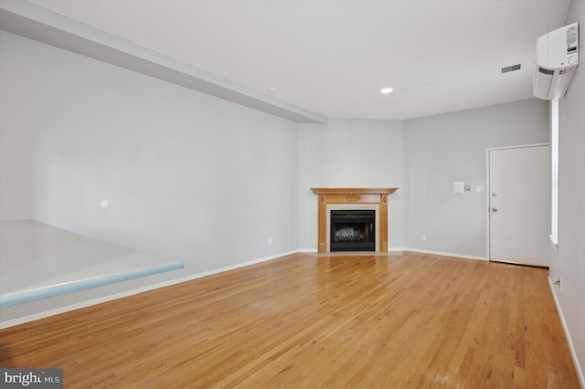 unfurnished living room with light hardwood / wood-style floors